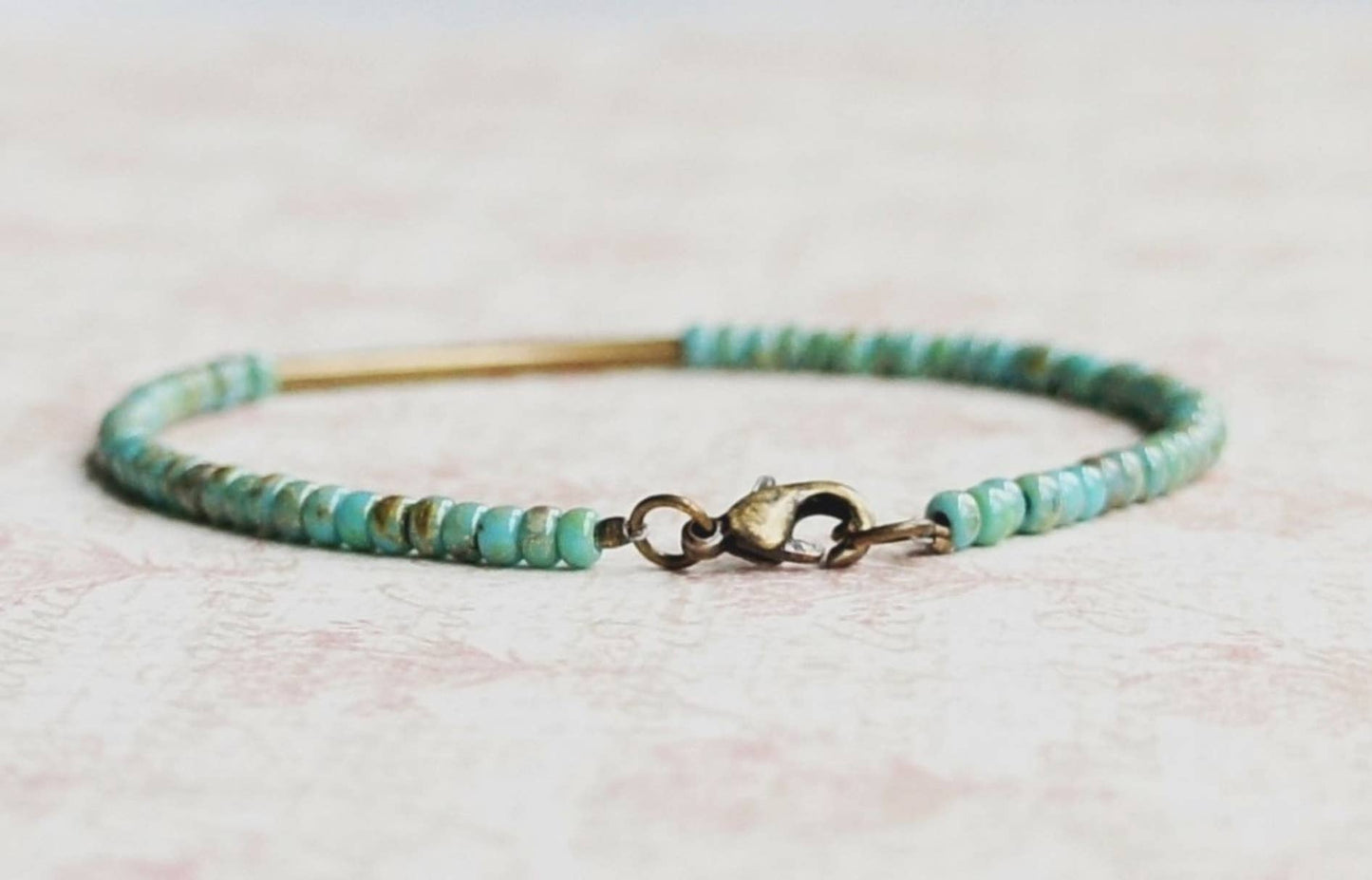 Turquoise Blue Seed Beads And Bronze Bar Bracelet: 7"
